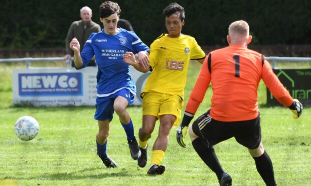 Fort William's Lerlah Hay's attack on the Golspie goal is foiled by Louis MacPherson. Golspie left Claggan Park with a 2-0 opening day victory. Photograph: The Write Image