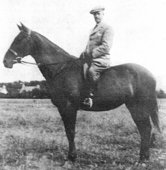 Dr George Mitchell on his mare Mona which was kept in a stable outside his house in Insch.
