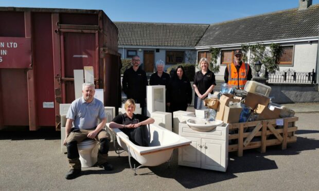 Hutchesons of Portsoy staff with some of the items in the boxes. Picture supplied by Hutchesons of Portsoy