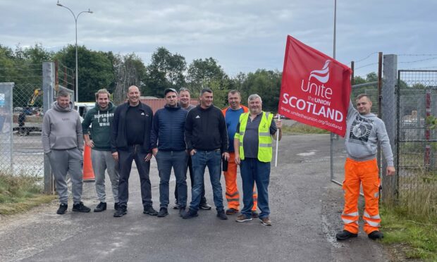Unite members outside the Highland Council roads depot in Alness. Picture by Ross Hempseed