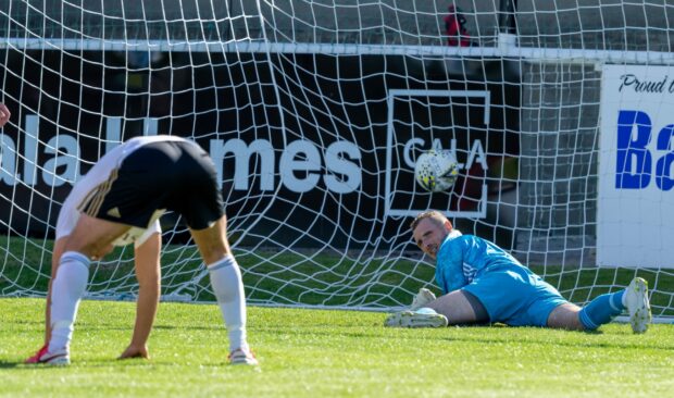 Formartine United goalkeeper Ewen Macdonald looks on as team-after team-mate Ryan Spink's own goal put Inverurie ahead.