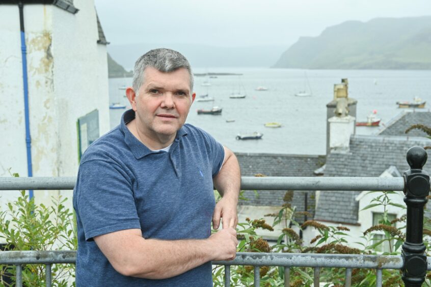 John Gordon on the sea front in Portree Skye. His dad John Angus Gordon died in the Covid-19 pandemic. He will be attending the Covid Inquiry in Edinburgh on Monday.