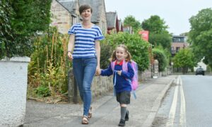 Jessica Munro sets off for her first day at Crown Primary, Inverness, with mum Dawn. Picture by Jason Hedges