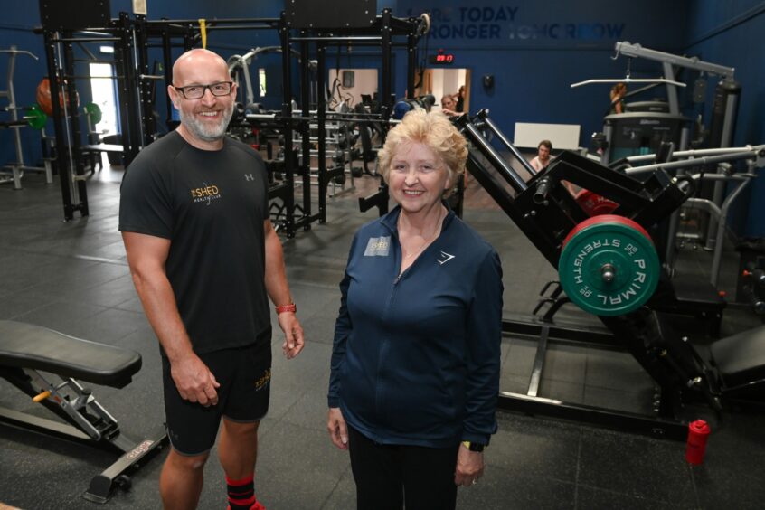 Mark Stephen and gym owner Hazel Combe working at the gym equipped for people with a disability. 