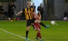 Ross Still in action for Huntly against Aberdeen in the quarter-final of the Evening Express Aberdeenshire Cup