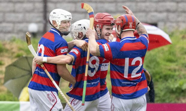 Kingussie's Lee Bain (second right) is congratulated on his spectacular goal.