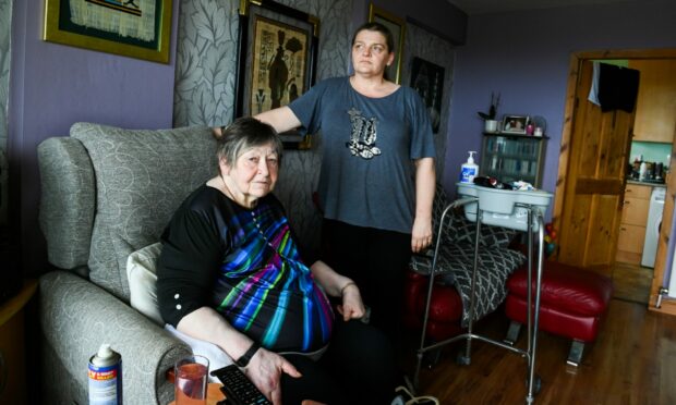 Lesley Armitage claims her mum Irene Begg - who has Parkinson's and dementia - is being expected to step over rotting floorboards in her council flat. Picture by Kami Thomson / DC Thomson