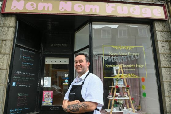 Nom Nom fudge owner Doug Hall in happier times - before rising costs have forced him to shut up shop. Pic Kami Thomson/DC Thomson