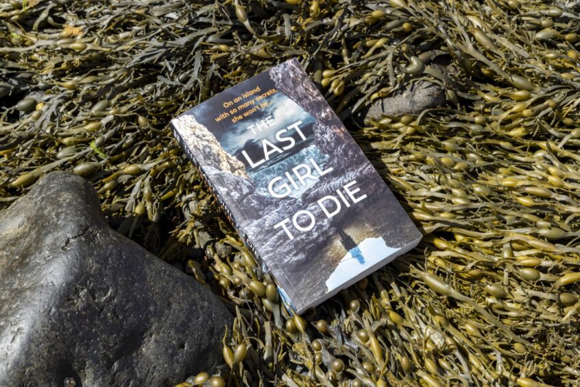 Fields' crime novel on Mull witches nestled in seaweed on the beach. 