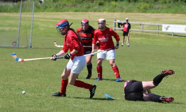 Kinlochshiel Ladies' Lexie MacKenzie, left, in against action Glenurquhart.