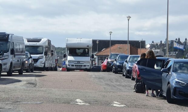 Cars and motor homes are parked on the side of Stonehaven's Beach Road. Picture by Allan Sutherland