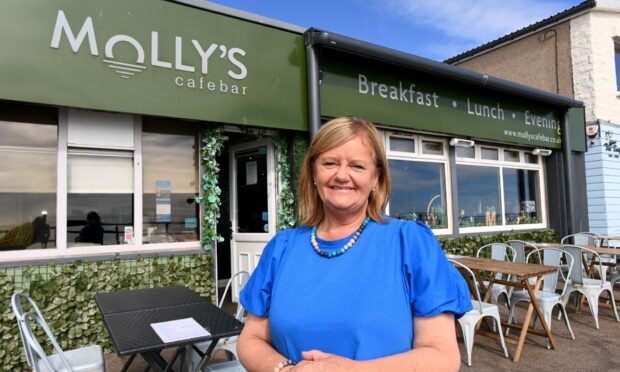 Seaside gem: Molly's Cafe Bar will be taking seafood to new depths after taking on a new head chef. Pictured is owner Janice Langdon. Photo by Darrell Benns.
