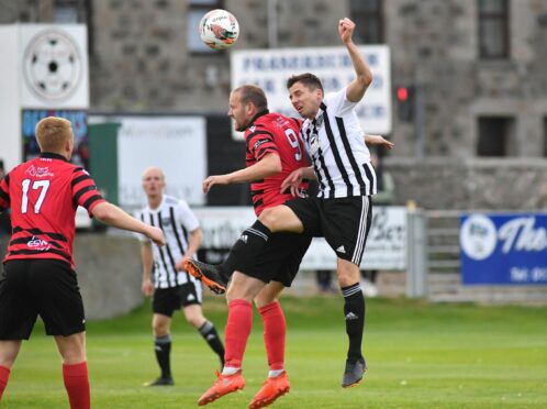 Fraserburgh's Paul Young and Gary Wood of Inverurie compete for the ball.