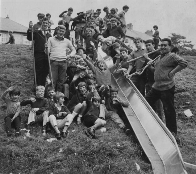 17 August 1971 - Powis youngsters, delighted with the news of a new play area near their homes, make a happy picture with some of the Police Cadets