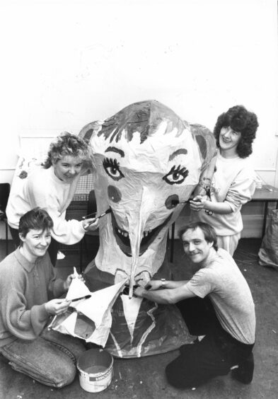 March 31 1989 - Pictured left, organisers Denise Whyte, Robert Duthie (front), Dorothy Kanemane and Susan Mennie (rear) pit the finishing touches to some of the masks. Powis is getting ready for its big day in a week's time. Locals have joined forces to make props and costumes for the area's festival next Saturday. Bunting and flags will decorate houses and a large marquee is being erected behind the community centre. The event will be started by Lord Provost R.A. Robertson, who will plant a new tree to replace one blown down a month ago. Co-ordinator Nick Millar said "We have about 30 adults working on it and all the children that use the centre. The whole day is a day of performance, music and celebration for all the people of Powis. The festival has been made possible by grants totalling £3000 from Aberdeen District Council and the Scottish Arts Council.