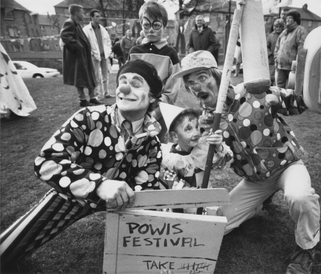 April 9 1989 - The Clown Jewels from Invergordon with John McGeoch (left) and David Smith (right) with young assistant Lee Hicks at the Powis Community Festival.