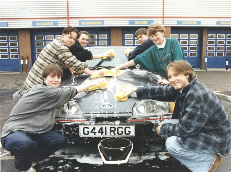 25 May 1991 - Young people from Powis, the Ready for Life Group, held a car-wash at Halfords, Bedford Road, Aberdeen, on Saturday to raise money for an educational trip to Aberdeen's twin city, Regensburg, in October. They are, from left: Lee Downey (15); Kenny Rankine (15); Donna Fraser (15); Stuart Downey (17); Claire Dale (14) and Willie Jackson (17)