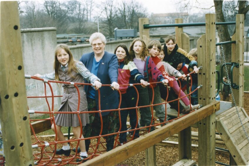 March 1993 - Aberdeen councillor Maureen Irons has a go as she helps launch a new adventure playground for children in the city's Powis area. A whole new world of adventure opened up to youngsters today on a busy Aberdeen estate. Community leaders hop the new adventure playground in Powis will keep youngsters off the streets and out of mischief. The £14,000 playground was funded from a £200,000 pool of cash set aside by Aberdeen District Council to provide more facilities for youngsters. District councillor Maureen Irons identified Powis as a suitable site for some of the first cash and was delighted to see the ground open to children after a year's planning.