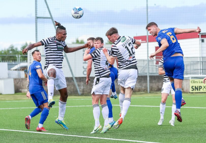 Morgyn Neill heads over for Cove Rangers