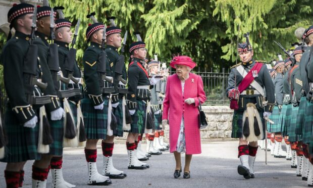 The Queen inspecting The Royal Regiment of Scotland at the gates of Balmoral as she takes up residence last year.
Photo: Jane Barlow/PA Wire.