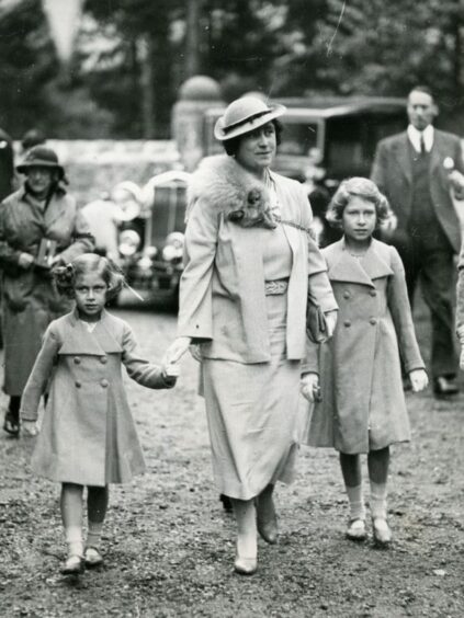 The two princesses walking with their mother