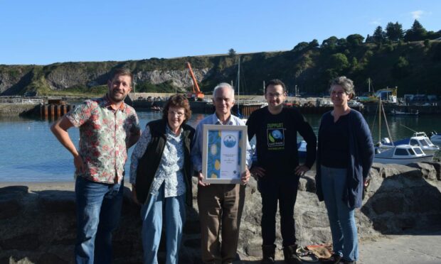 Stonehaven Fair Trade Group chair Peter Bellarby and group members with the award. Picture supplied by Stonehaven Fair Trade Group.