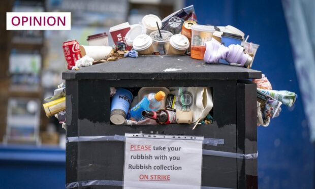 A bin overflowing with litter in Edinburgh as a result of worker strikes (Photo: Jane Barlow/PA)