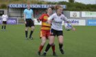 Aberdeen's Eilidh Shore battles with Partick Thistle's Rachel Donaldson in the 2-2 draw. Image: Wullie Marr.