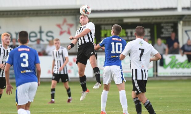 Fraserburgh's Scott Murison, centre, who was later sent off, wins a header against St Johnstone B