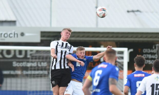 Fraserburgh's Kieran Simpson, left, wins a header against St Johnstone B.