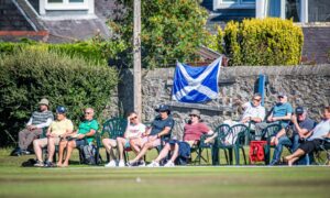 Scotland supporters watch on at Mannofield. Picture by Wullie Marr