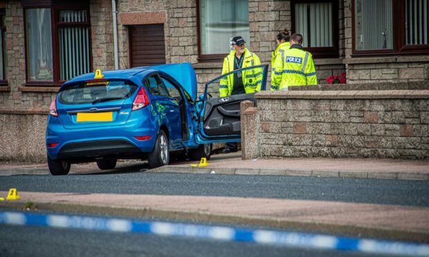 Police at the scene on Meethill Road. Photo: Wullie Marr/DC Thomson