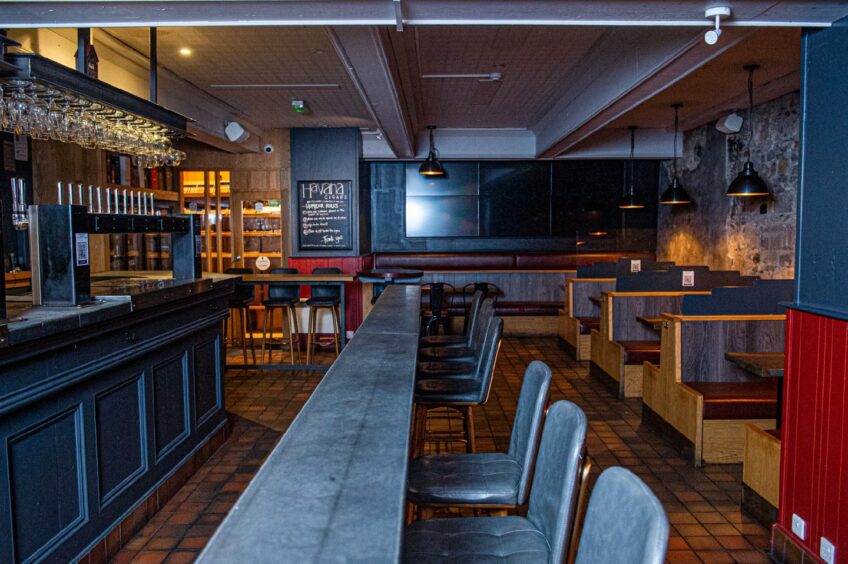 The inside of the bar, with the seats and and bar area