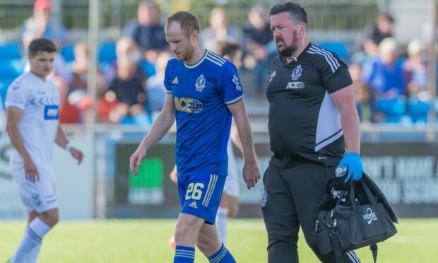 Cove Rangers' Mark Reynolds goes off injured during the game against Ayr United. Photos by Dave Cowe