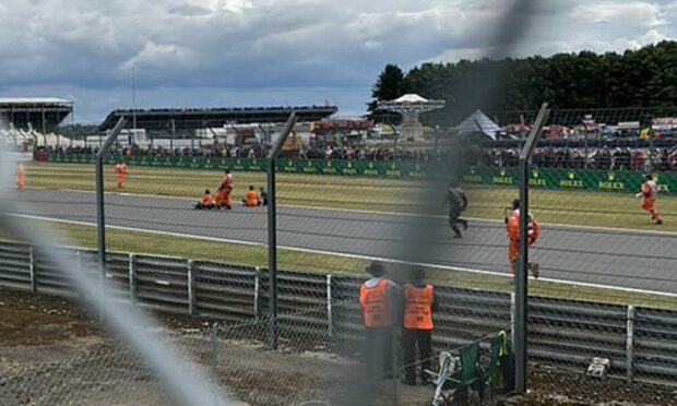 Photographs were taken of protestors sitting on the Formula 1 track at Silverstone. Photo: PA