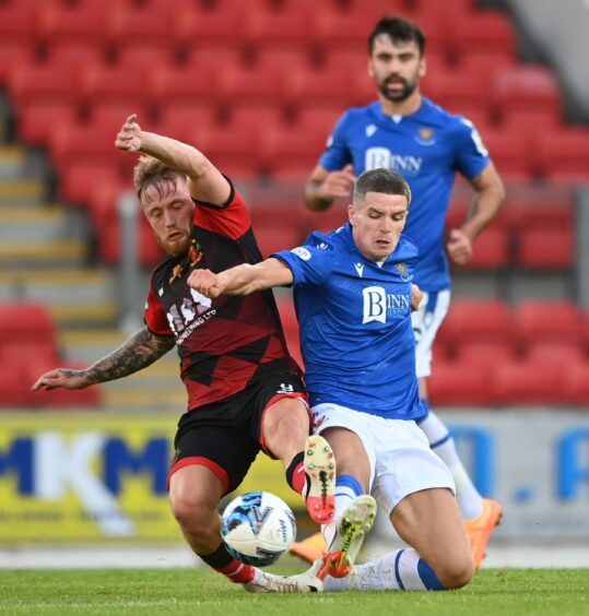 PERTH, SCOTLAND - JULY 12: Annan's Aidan Smith and St Johnstone's Charlie Gilmour during a Premier Sports Cup match between St Johnstone and Annan Athletic at McDiarmid Park.