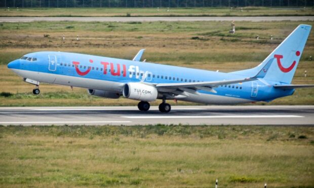 A Boeing 737-800 operated by Tui. Photo by Sascha Steinbach/EPA-EFE/ Shutterstock.