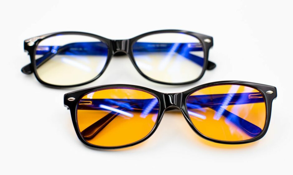 Two pairs of Blue light glasses with clear and yellow-tinted lenses.