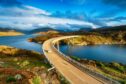 The Kylesku Bridge spanning Loch a' Chàirn Bhàin in the Scottish Highlands and a landmark on the North Coast 500 tourist driving route. Pic by Shutterstock / Helen Hotson.