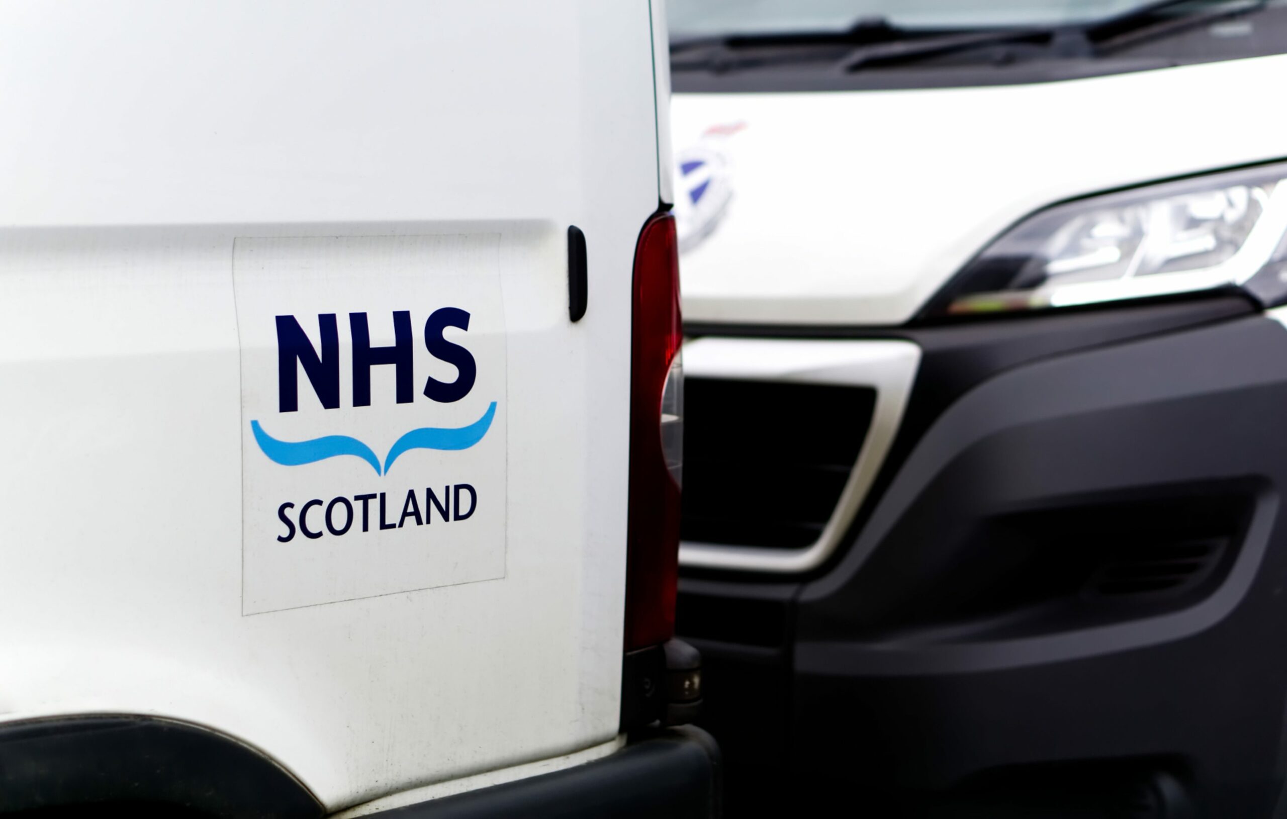 Van with NHS Scotland signage.