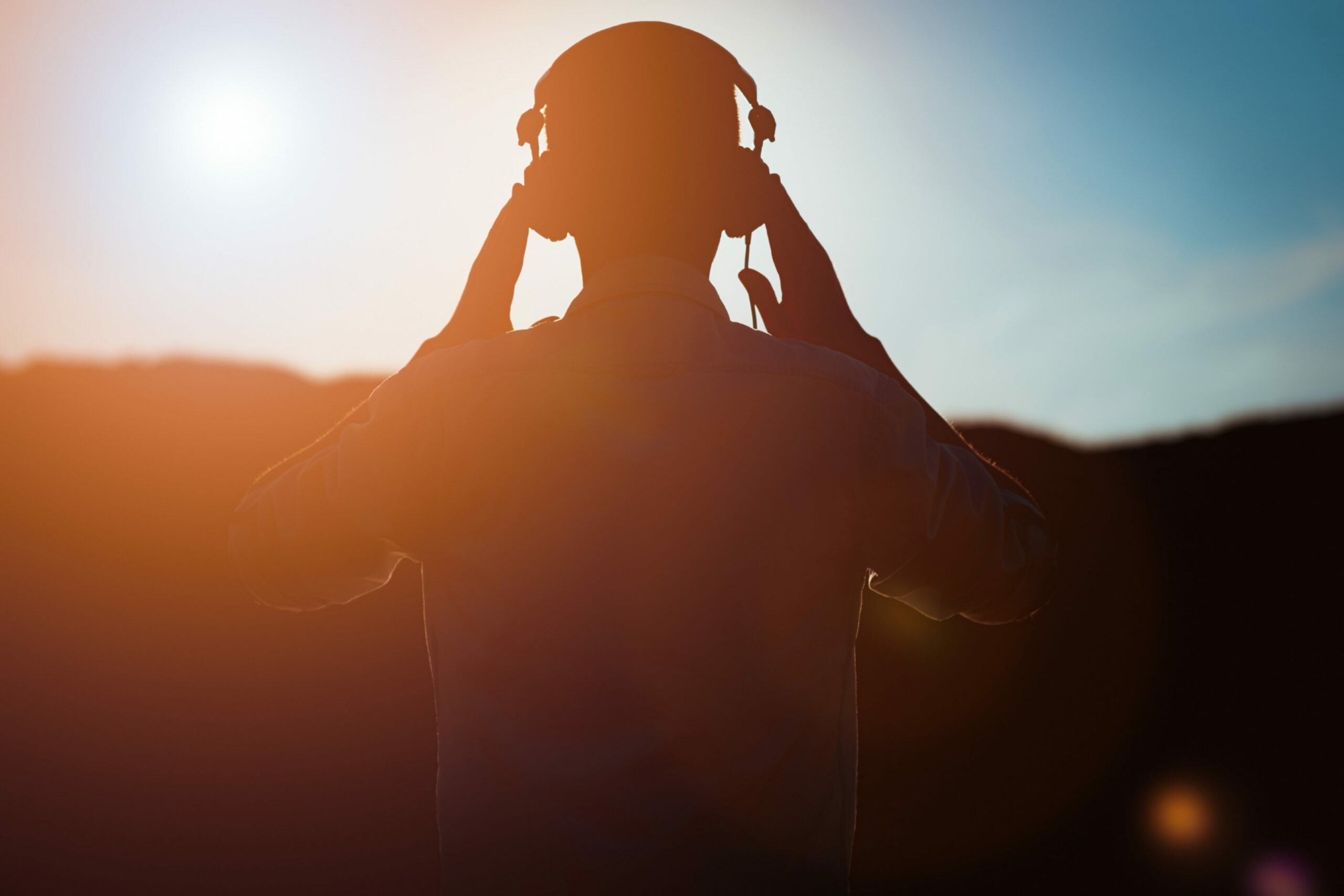 Man listening to music with headphones on.