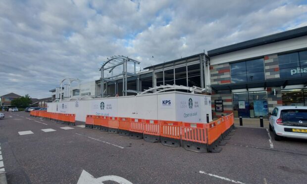 Contractors have erected a new facade outside the vacant outlet at Inverness Retail and Business Park.