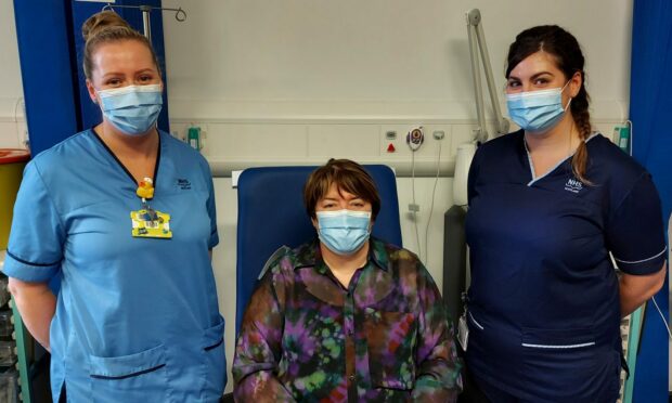Natalie Carnegie (Specialist Nurse, OPAT - light blue tunic), Carol Spence, and Fiona Elliot (Senior Charge Nurse, OPAT - navy tunic)