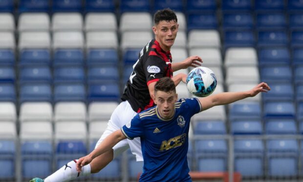 Caley Thistle defender Zak Delnaney in action against Cove Rangers. Image: SNS Group