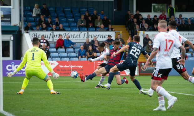 Aberdeen's Vicente Besuijen strikes at goal against Ross County.