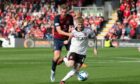 Ross County's Jordan White (L) and Aberdeen's Hayden Coulson in Premiership action.