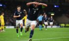 Scotland's John McGinn celebrates scoring to make it 1-0  against Ukraine.