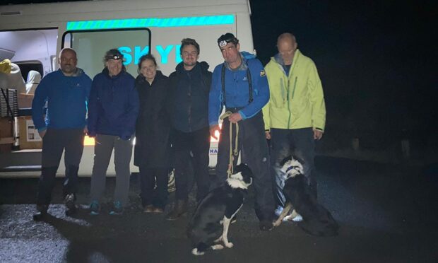 The couple and their rescuers. Picture supplied by Skye Mountain Rescue Team.