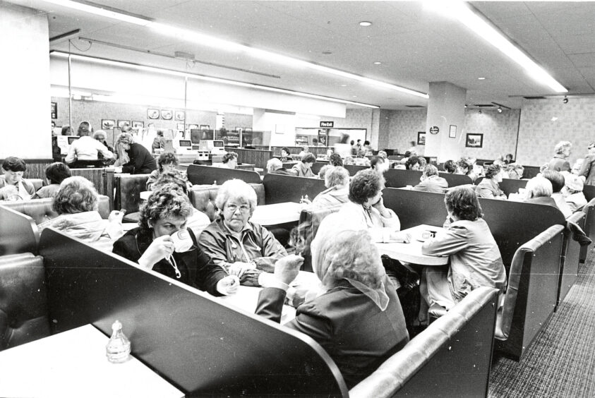 People eating and drinking in the Littlewoods restaurant 