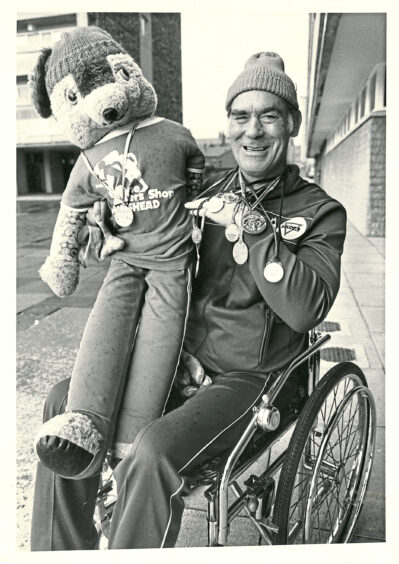 1983 - Wheelchair entrant Brian Charlton, 39, travelled up from Newcastle with mascot Super Geordie ahead of their 50th event of the year.